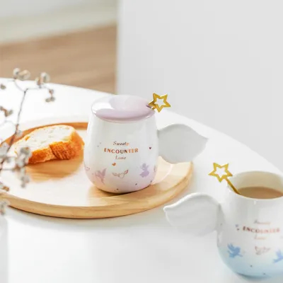 Buy Enchanting Ceramic Mug with Angel-Wing Handles amp Golden Star Stirrer Adorned with Soft Pink amp Light Blue Gradients online manufacture