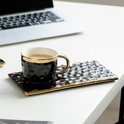 Elegant Black Ceramic Mugs With Gold Accents Wavy Textures For Coffee Tea Pastry Pairings Modern Minimalist Design
